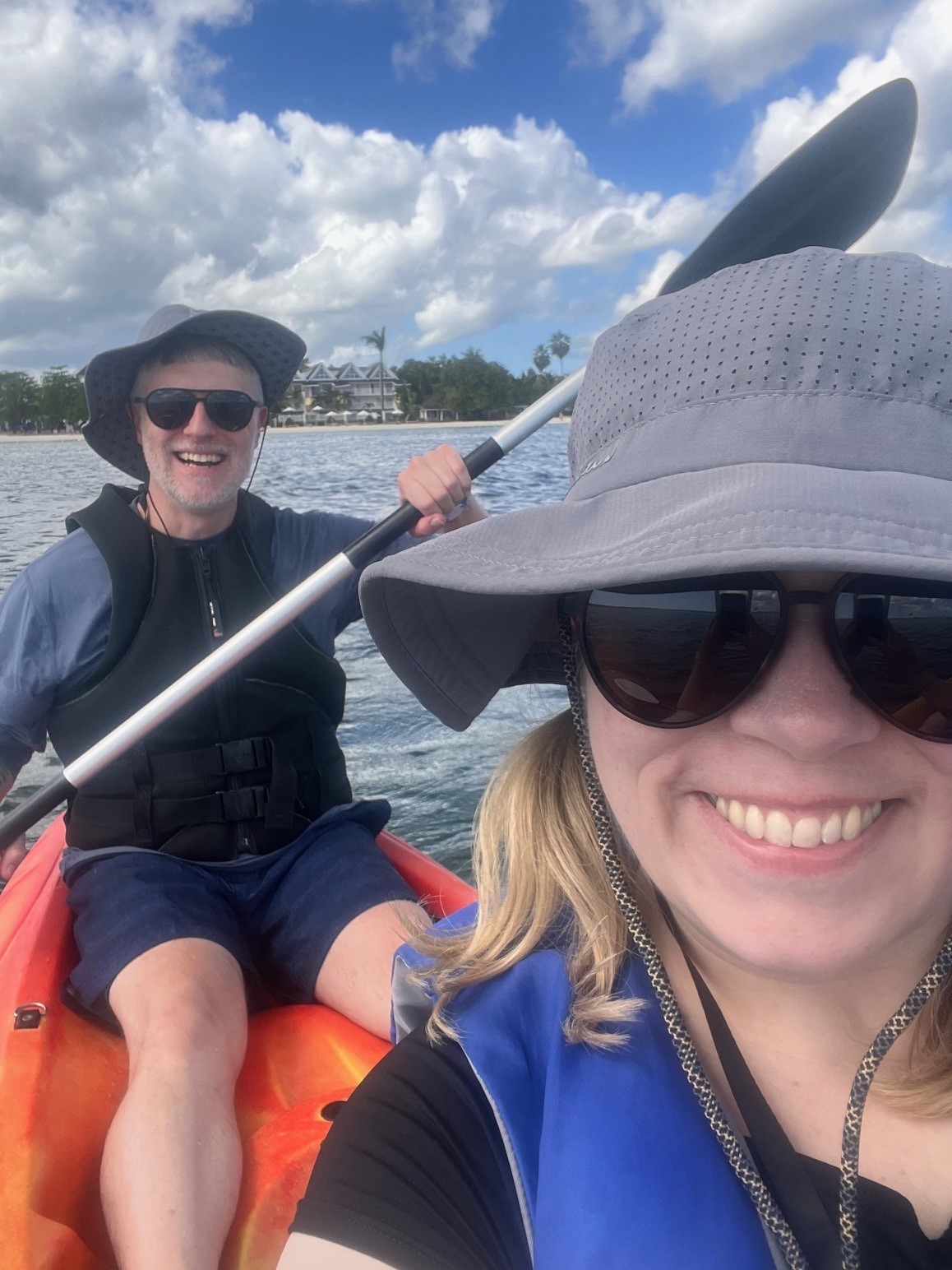 smiling couple in kayak